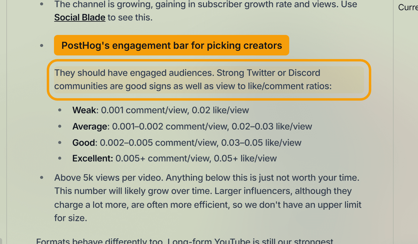 PostHog handbook section setting its engagement bar for picking creators, listing view-to-comment and like ratios graded weak at 0.001 comment per view, average at 0.001 to 0.002, good at 0.002 to 0.005 and excellent at 0.005 or more, plus a floor of 5,000 views per video