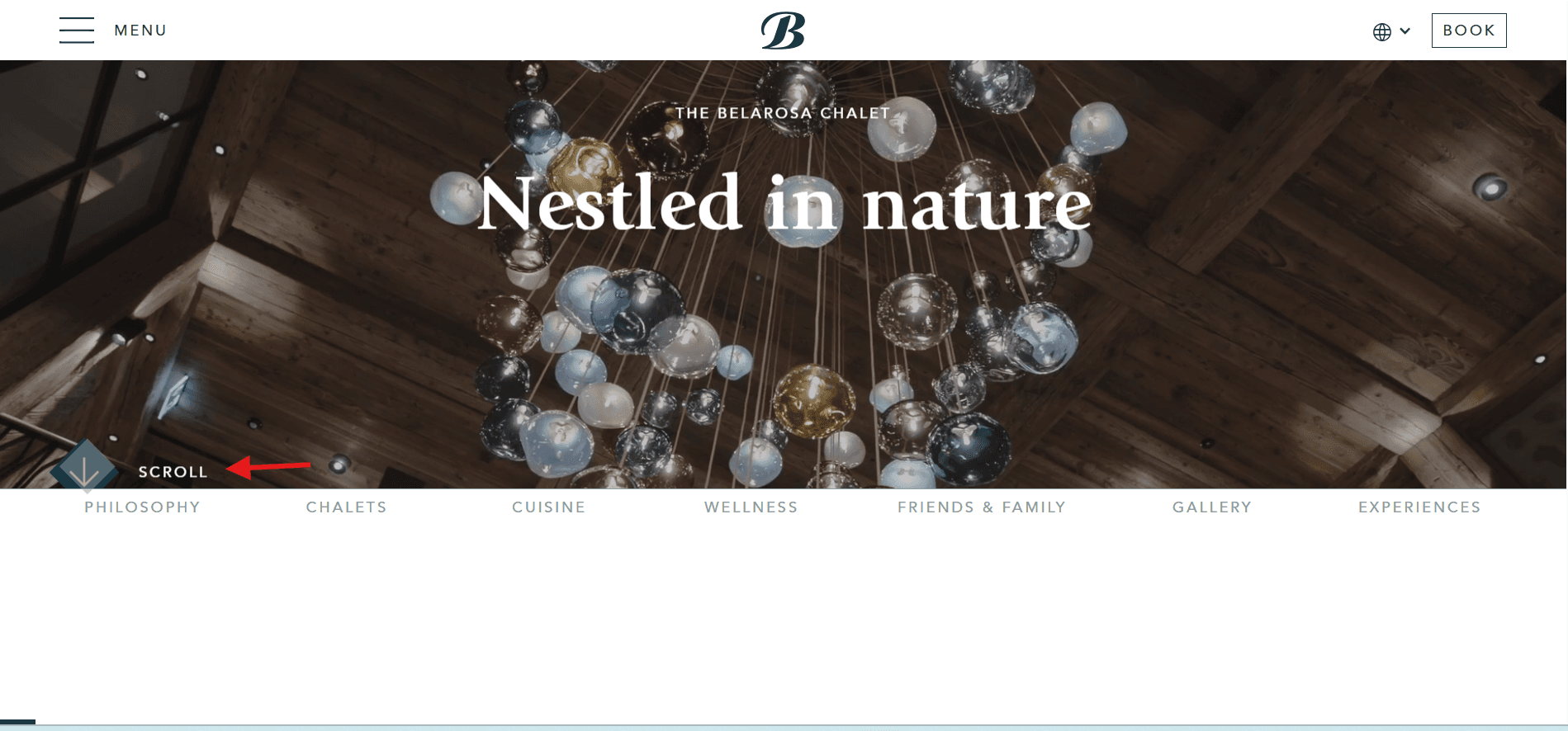 Chalet website hero with a scroll prompt in the lower left, an example of scroll storytelling where copy is revealed progressively as the visitor moves down the page